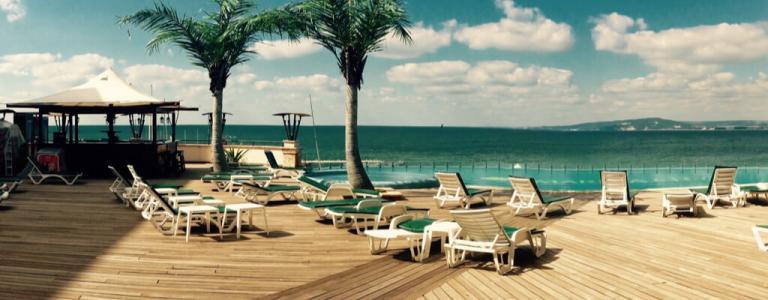 Resort - including deck chairs and swimming pool.