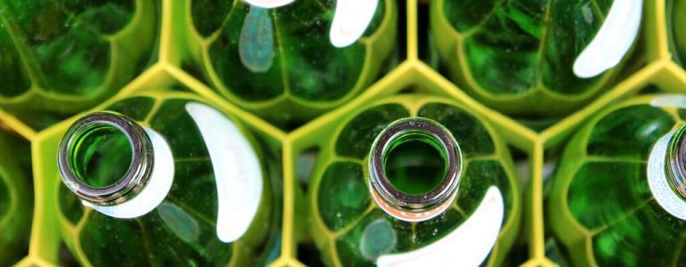 Close up of green bottles.