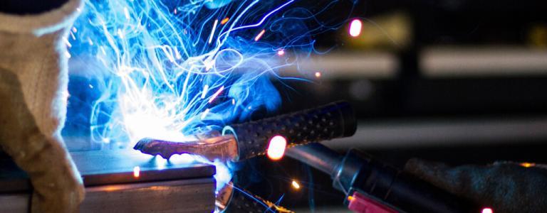 Power plant - bright sparks coming from tool.