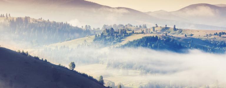 Foggy view of rolling hills.